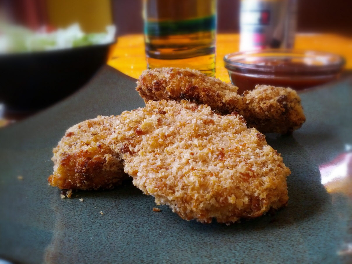 Crispy baked chicken fingers with homemade panko. Super healthy alternative to fried chicken!