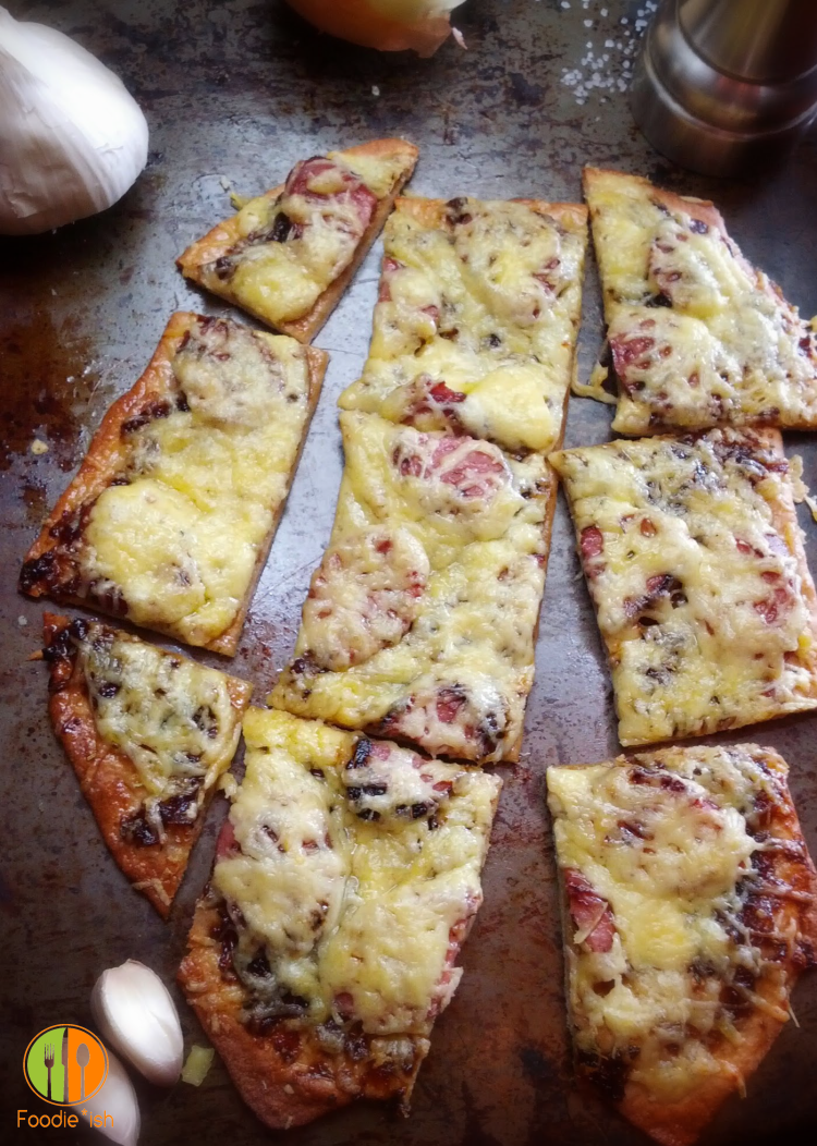 Onion and sausage pizza with gouda