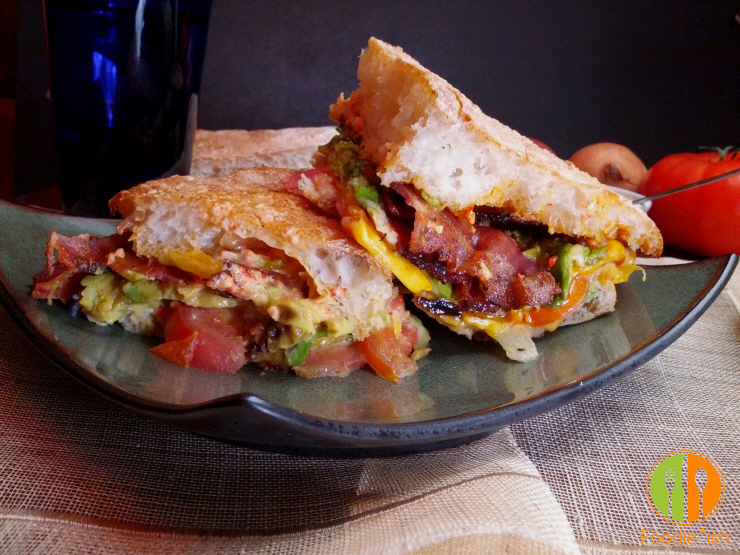 BLT melt with avocado on ciabatta bread with roasted red pepper aioli